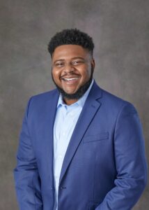 BGSU MBA graduate Michael Williams smiling for photoshoot