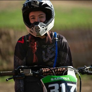 BGSU Online MBA graduate Sabrina Williams riding dirt bike